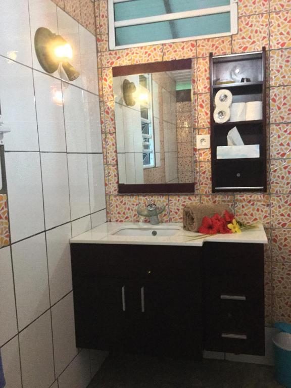 Private bathroom with vanity and mirror